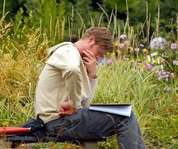 A-man-reading-and-contemplating-a-text (1) A man reading and contemplating Dharma teachings