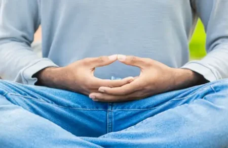 A man in a Meditation Lesson meditating with fingers in meditative poise