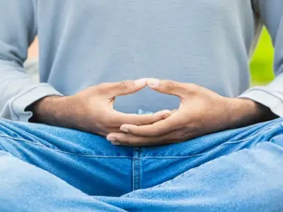 A man in a Meditation Lesson meditating with fingers in meditative poise