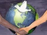 Prayers for World Peace: The world with 2 people shaking hands in front of it with a dove representing World Peace