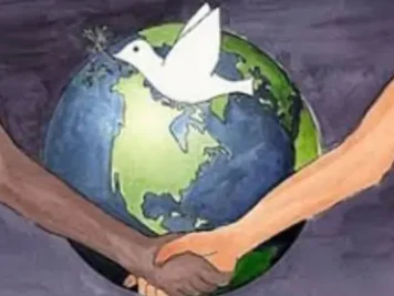 The world with 2 people shaking hands in front of it with a dove representing World Peace